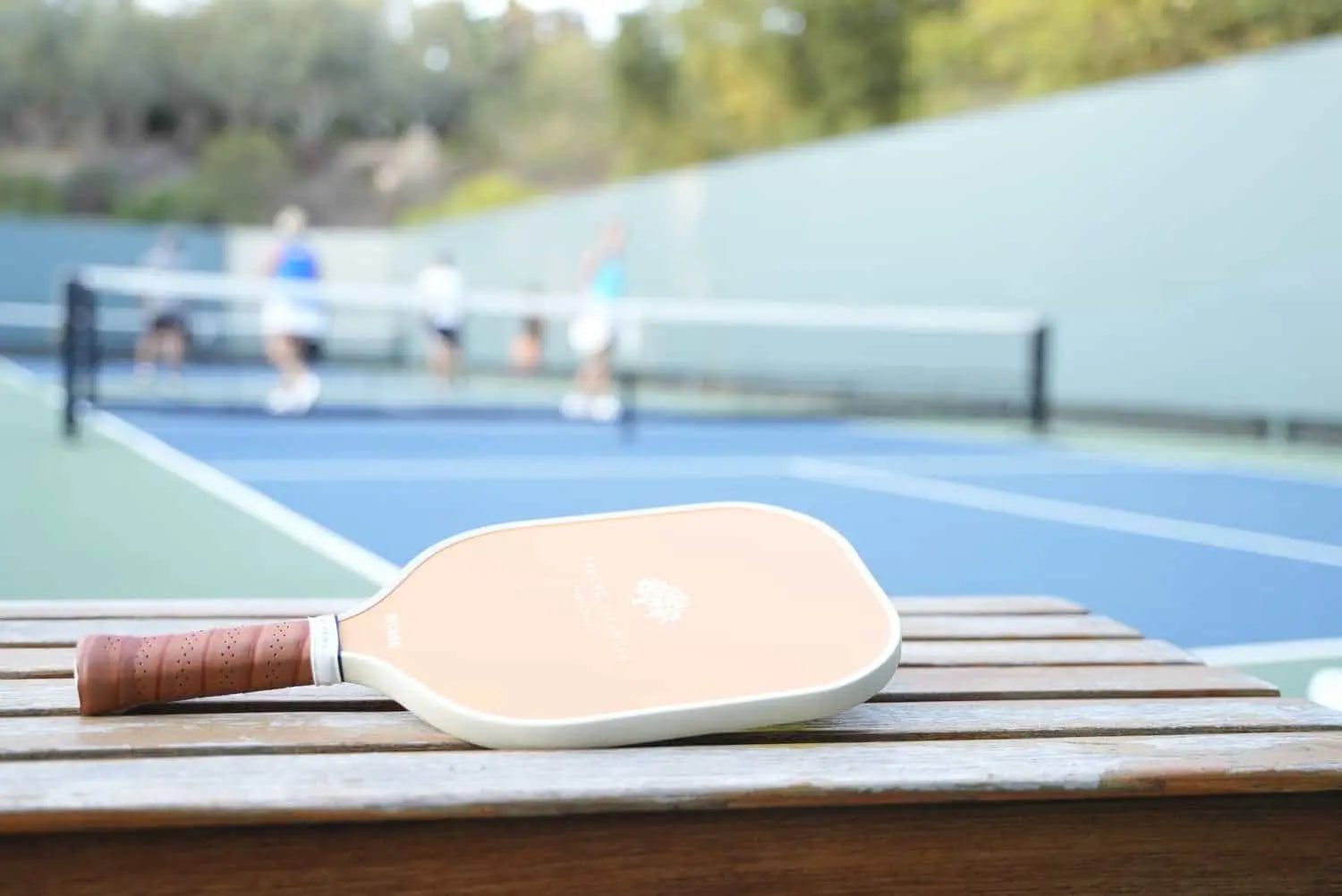 Premium pickleball paddle on a court representing the Luxury Pickleball lifestyle.
